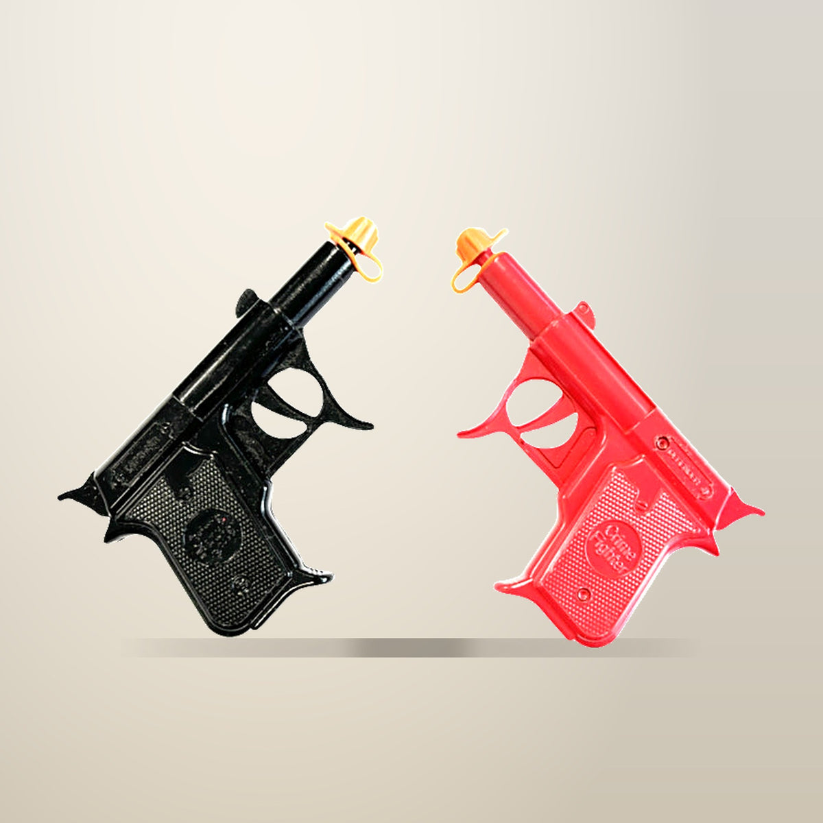 NuSea 2 Pack Diecast Metal Spud Guns, Red and Black, on a plain cream background