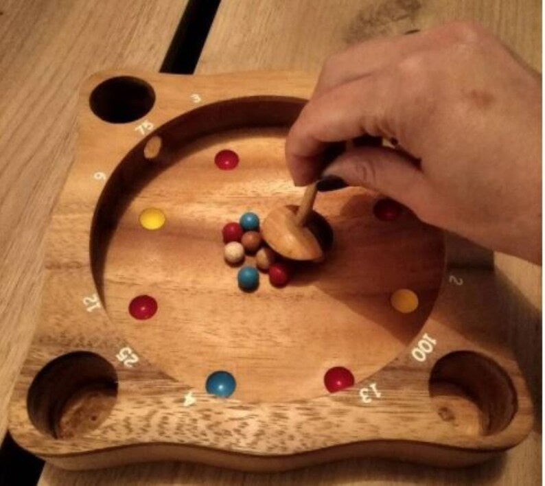 Rollele Roulette ball spinning board game