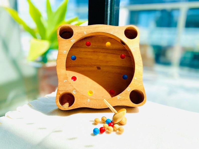 Rollele Roulette ball spinning board game