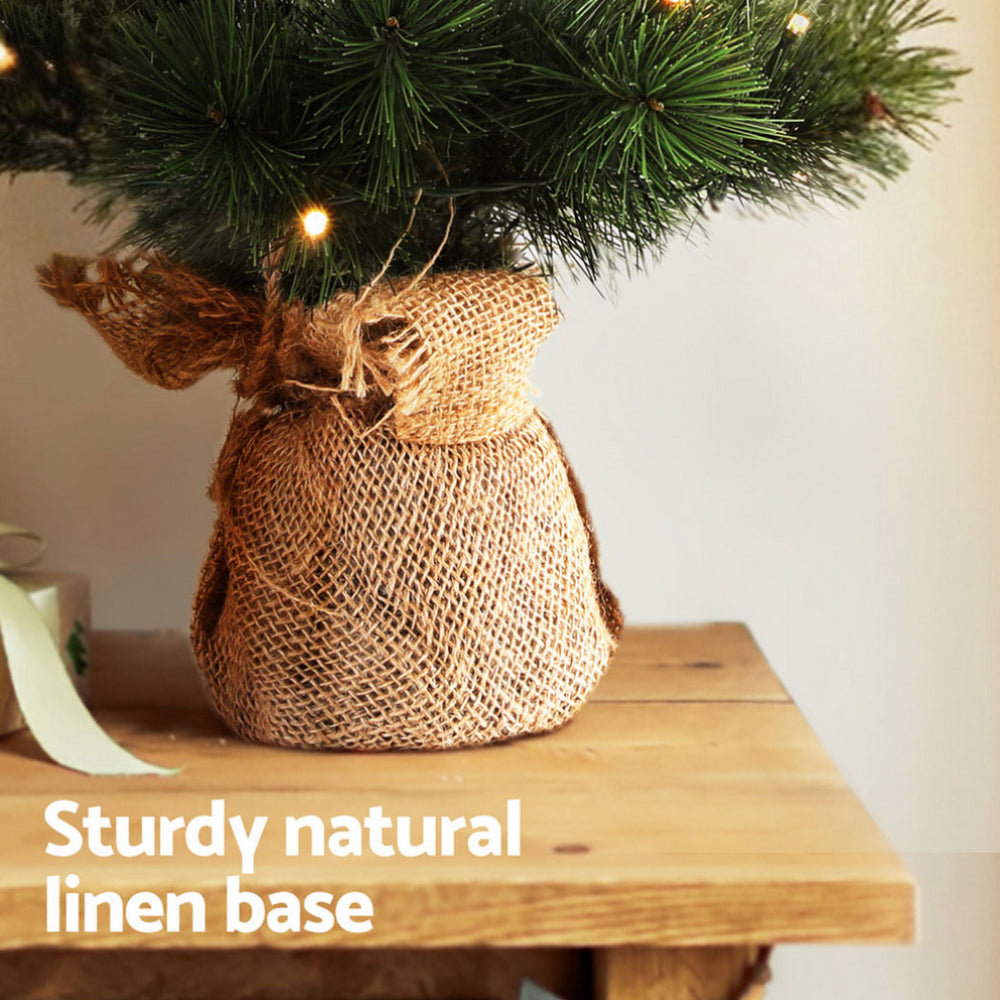 Jingle Jollys Battery Lit Tabletop Christmas Tree, 60 cm, shown in a real setting, photo 6 of 7