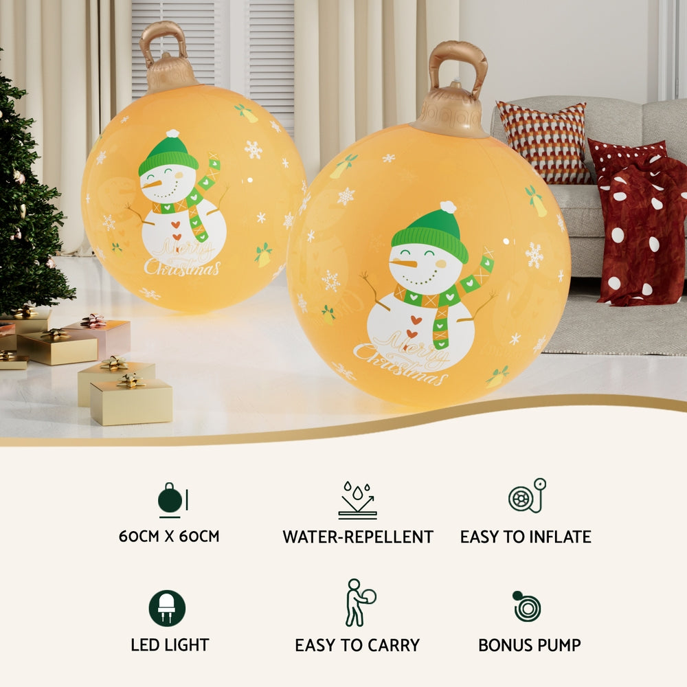 Jingle Jollys 60 cm Inflatable LED Snowman Bauble, Gold, shown in a real setting