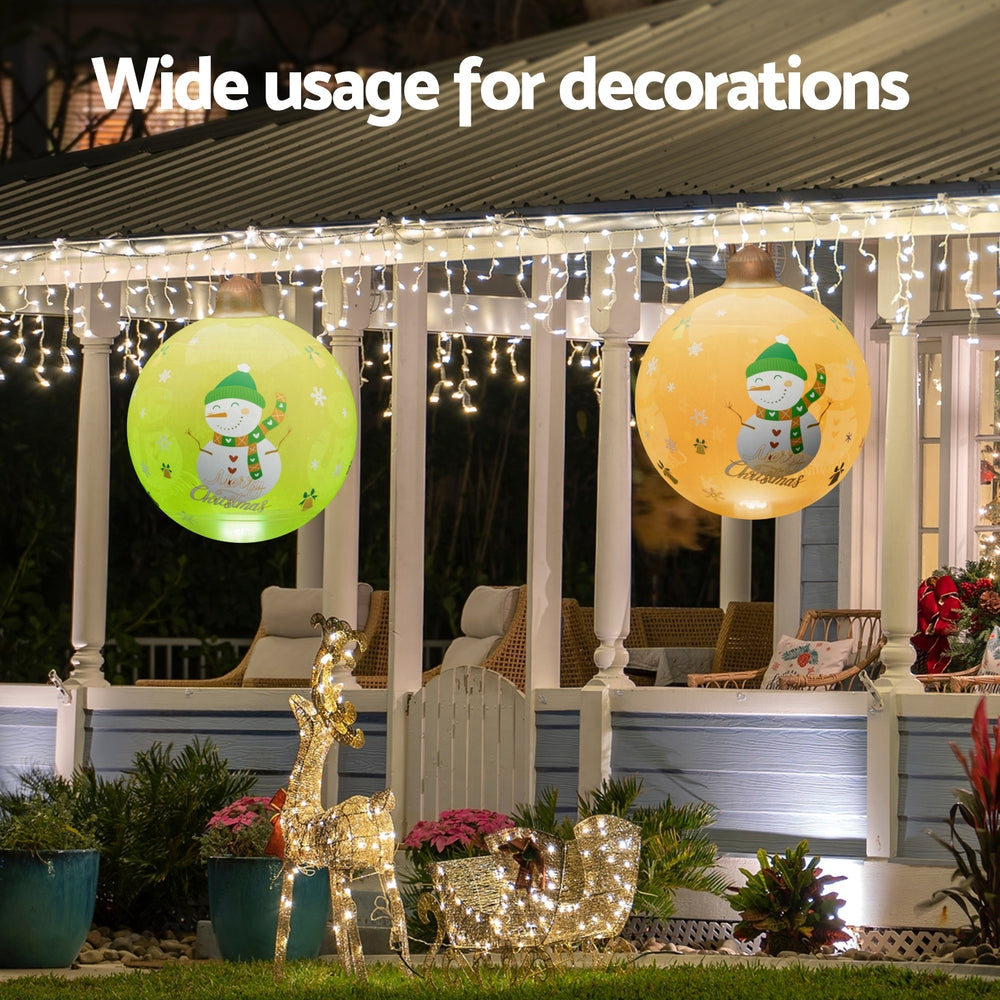 Jingle Jollys 60 cm Inflatable LED Snowman Bauble, Gold, shown in a real setting, photo 5 of 6