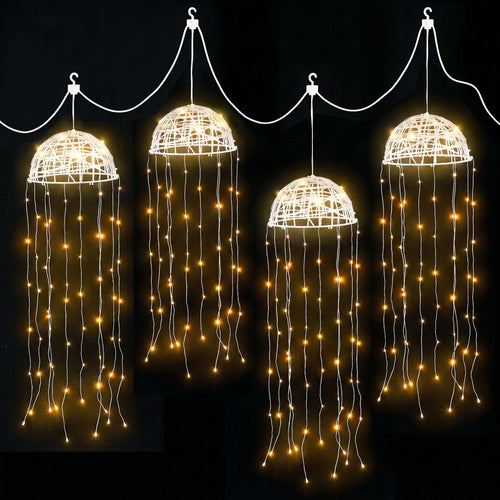 Jingle Jollys Solar Jellyfish Garden Lights, Warm White, 4 Pack, lit up in the dark