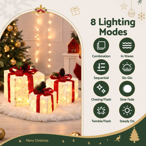 Jingle Jollys Lighted Gift Box Decorations, 3 Pieces, lit up in the dark