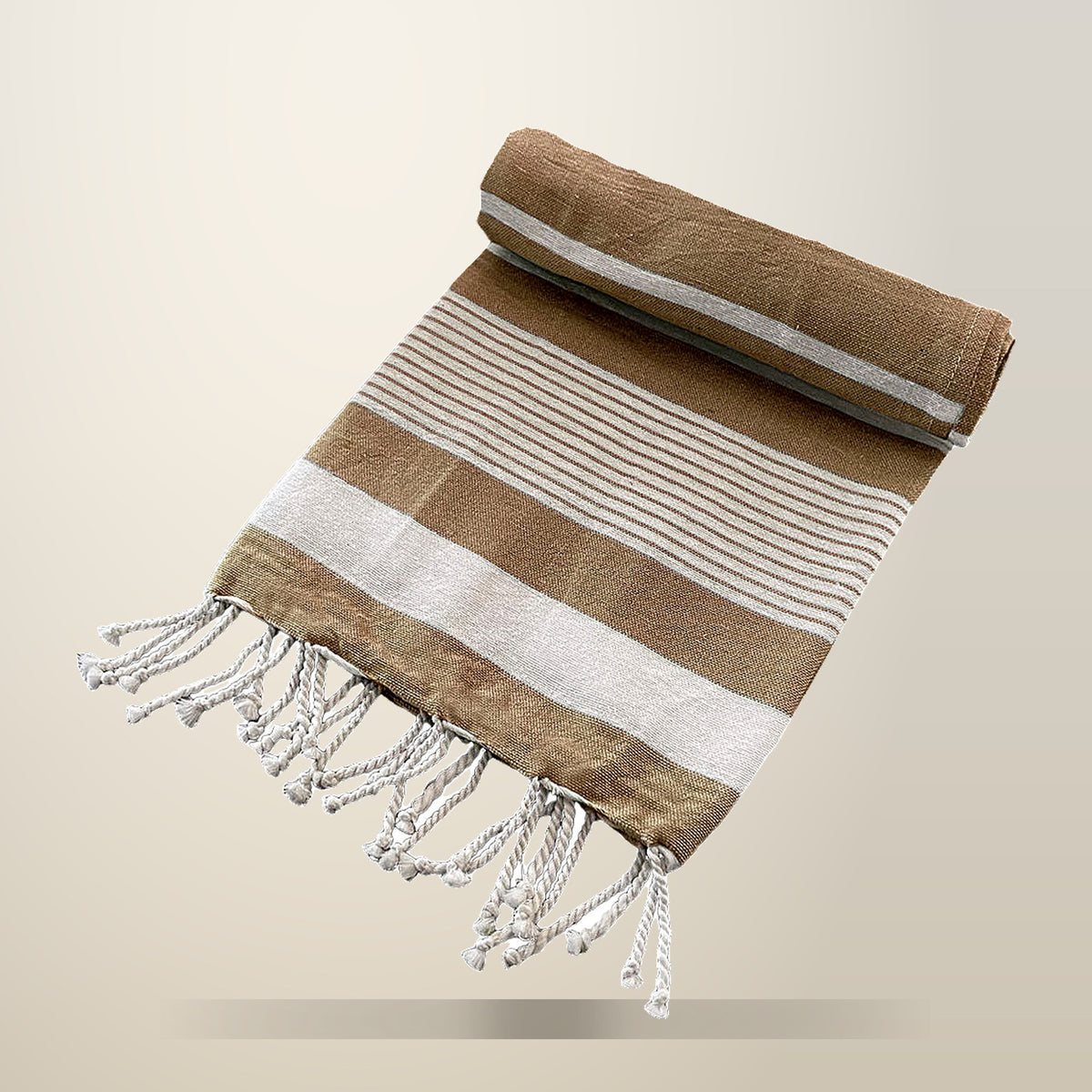 Cotton Rich Turkish Beach Towel with Tassels, 80 x 155 cm, on a plain cream background
