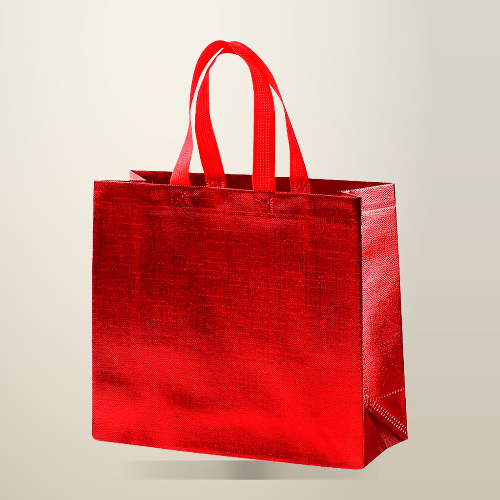 Embossed Non-Woven Gift Tote Bags, 25 Pack, 40 x 30 x 12 cm, on a plain cream background