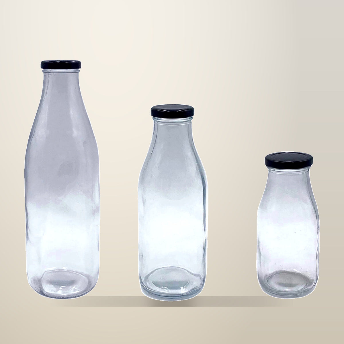 Glass Milk Bottles with Metal Lids, 500 ml, 24 Pack, on a plain cream background