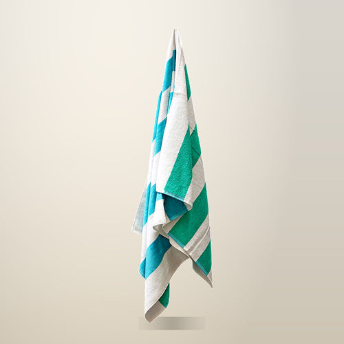 J.Elliot Home Reversible Striped Cotton Beach Towel, 400 GSM, on a plain cream background