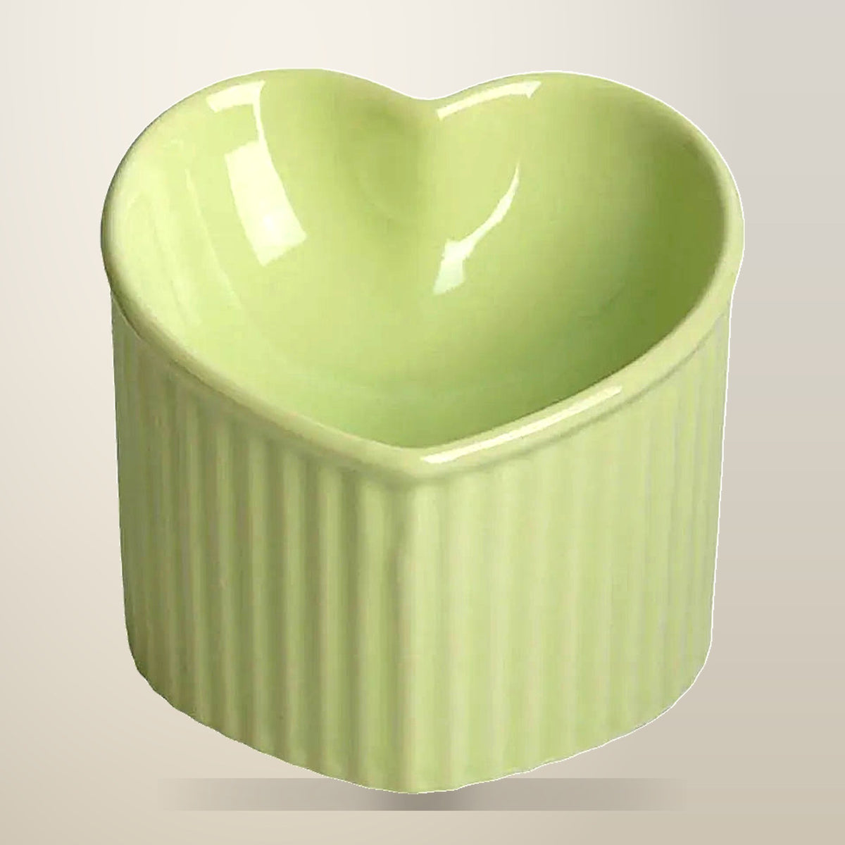 Heart Shaped Ceramic Cat Bowl, 200 ml, on a plain cream background