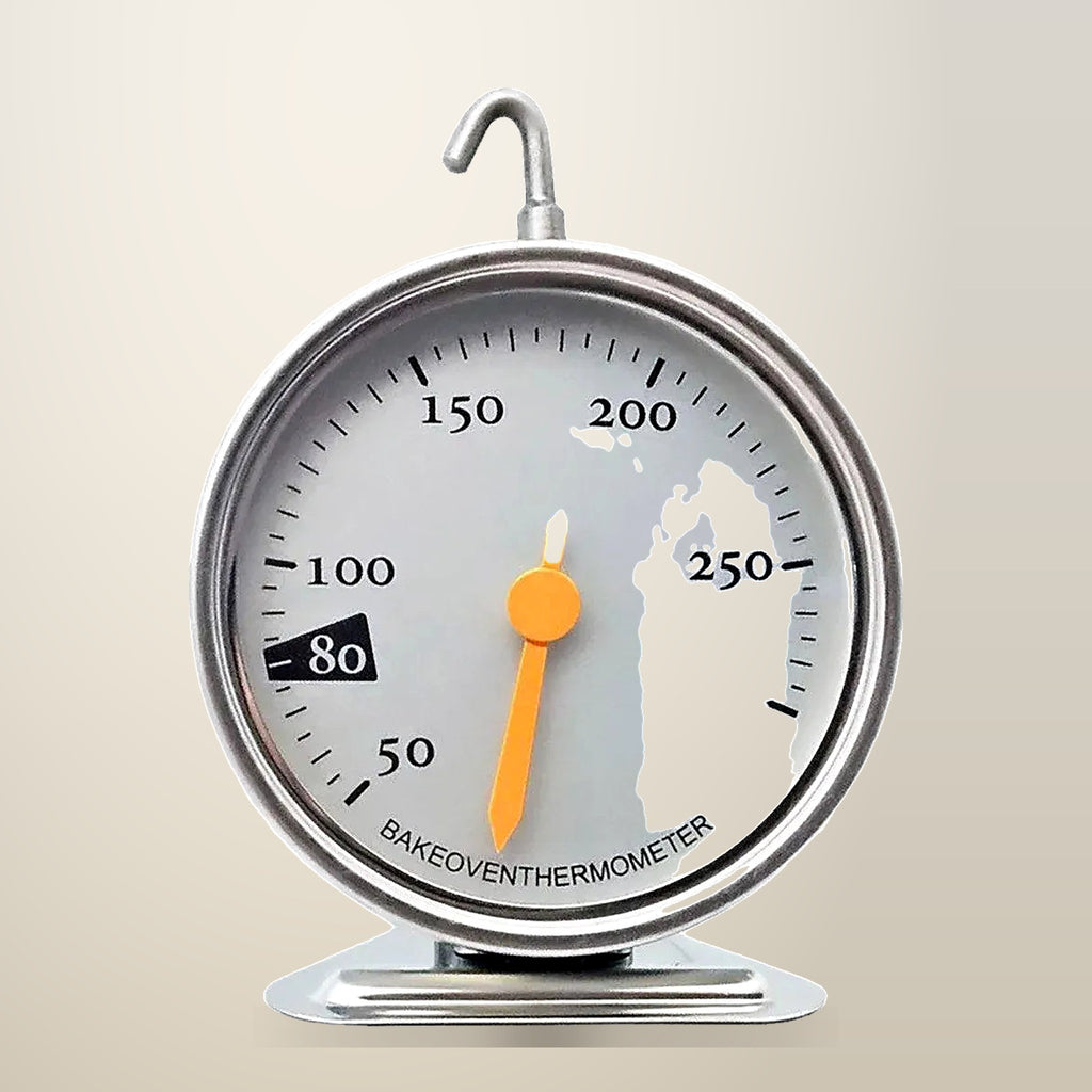 Mechanical Oven Thermometer with Hook and Stand, on a plain cream background