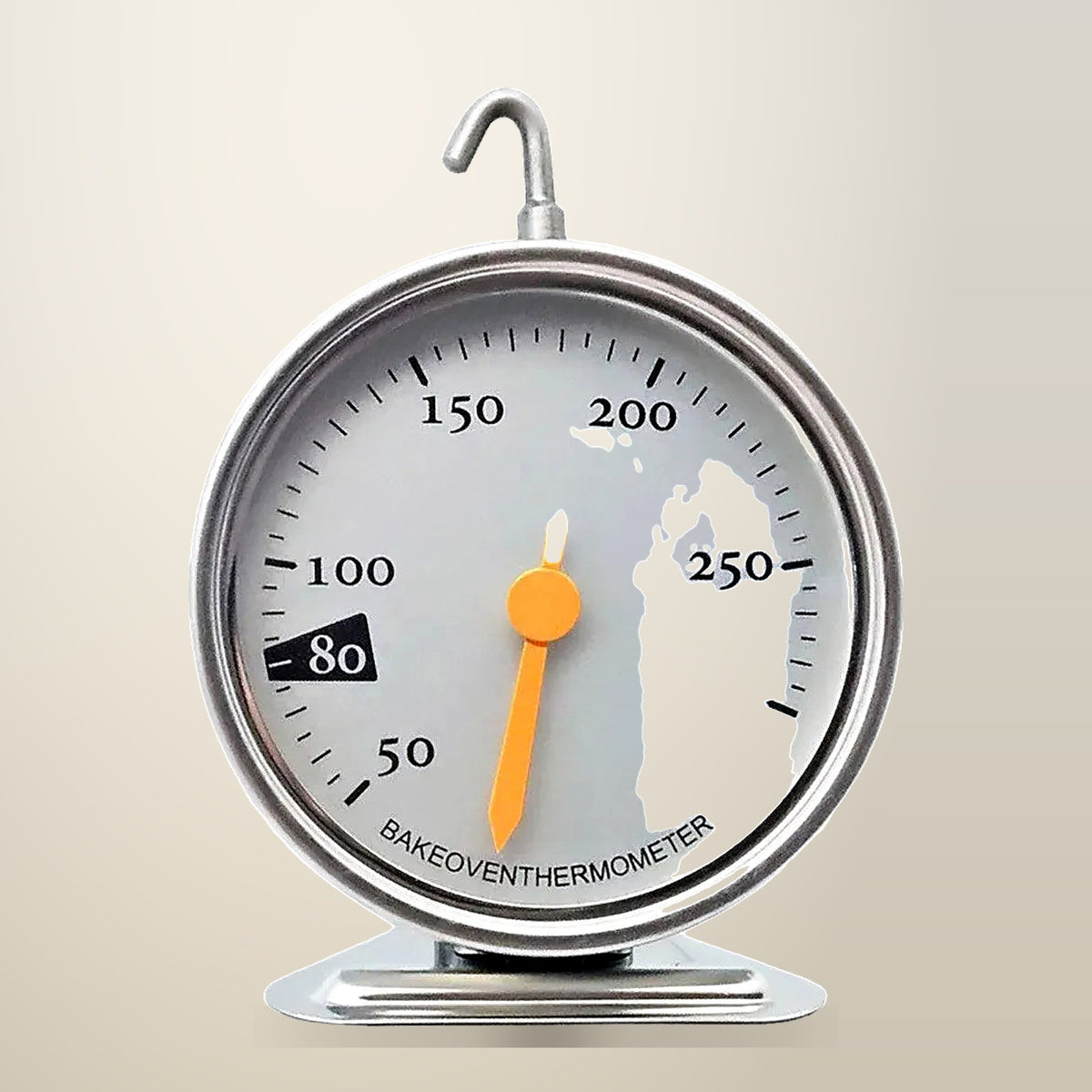 Mechanical Oven Thermometer with Hook and Stand, on a plain cream background