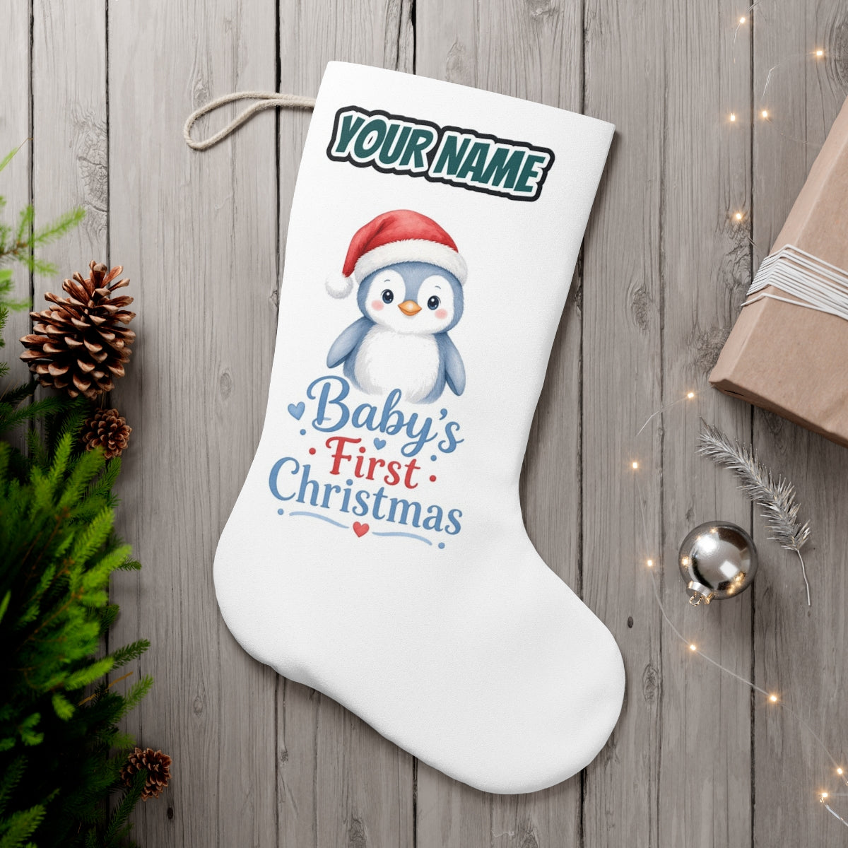 Penguin Baby's First Christmas personalised Christmas stocking, white, with the name across the top