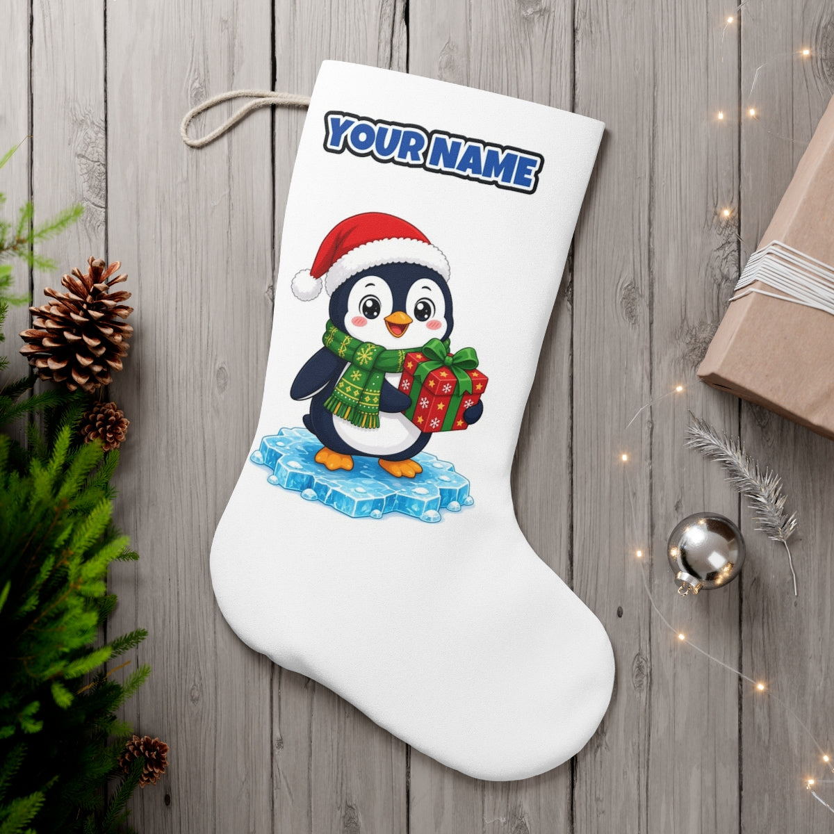 Penguin With a Present personalised Christmas stocking, white, with the name across the top