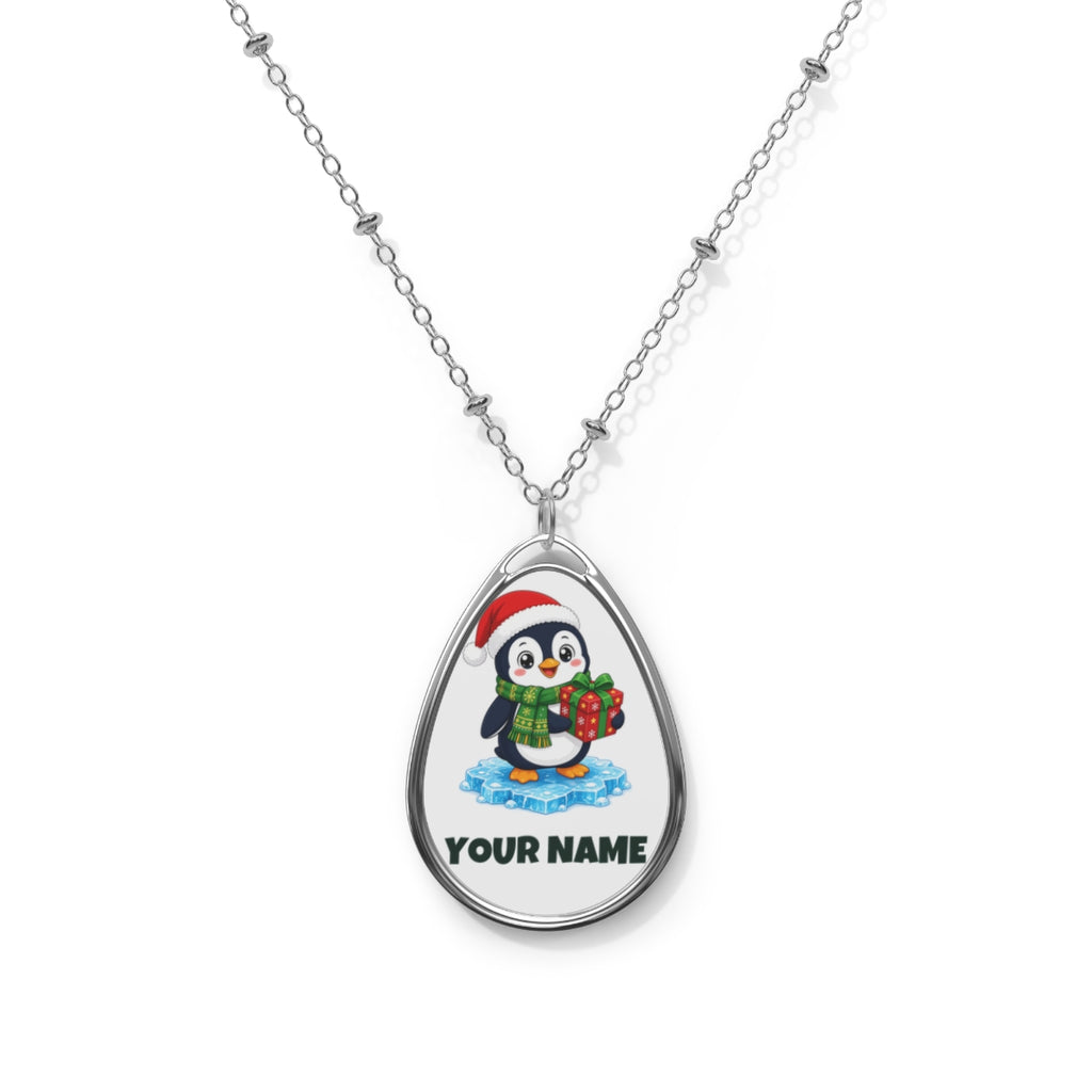 SV mockup: Personalised Oval Necklace, Your Design or Ours, shown with our Penguin With A Present design and YOUR NAME