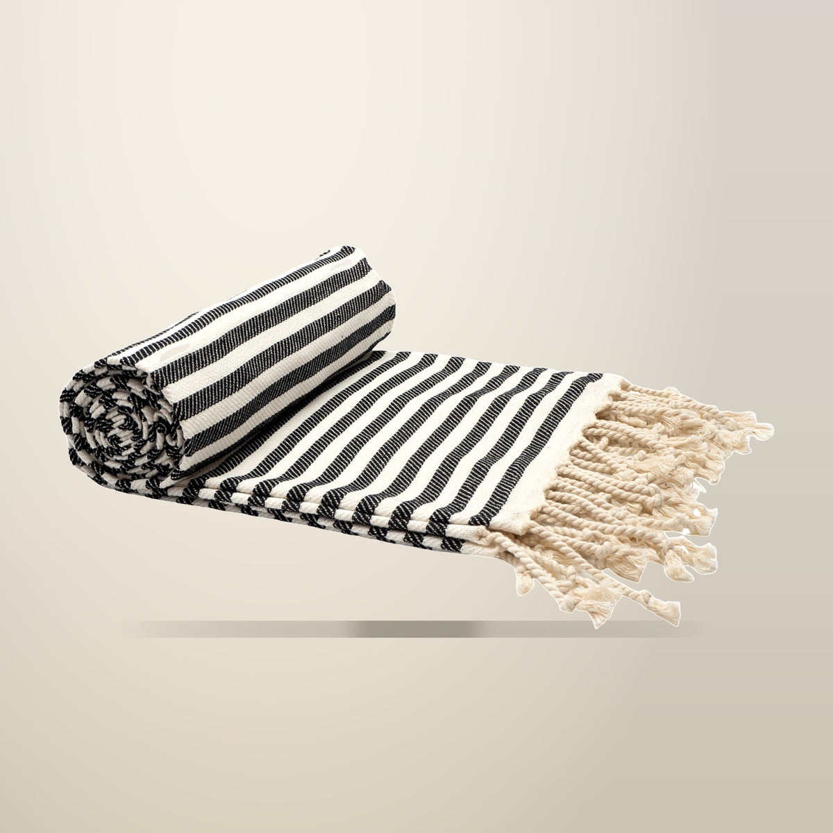 CODU Portsea Turkish Cotton Beach Towel, Midnight Black, on a plain cream background