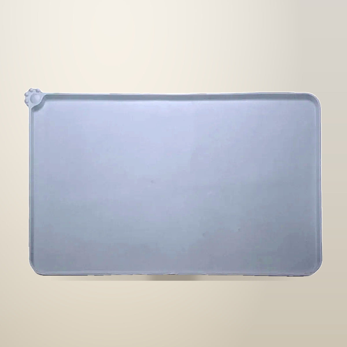 Grey Silicone Pet Feeding Mat, Spill Proof, on a plain cream background