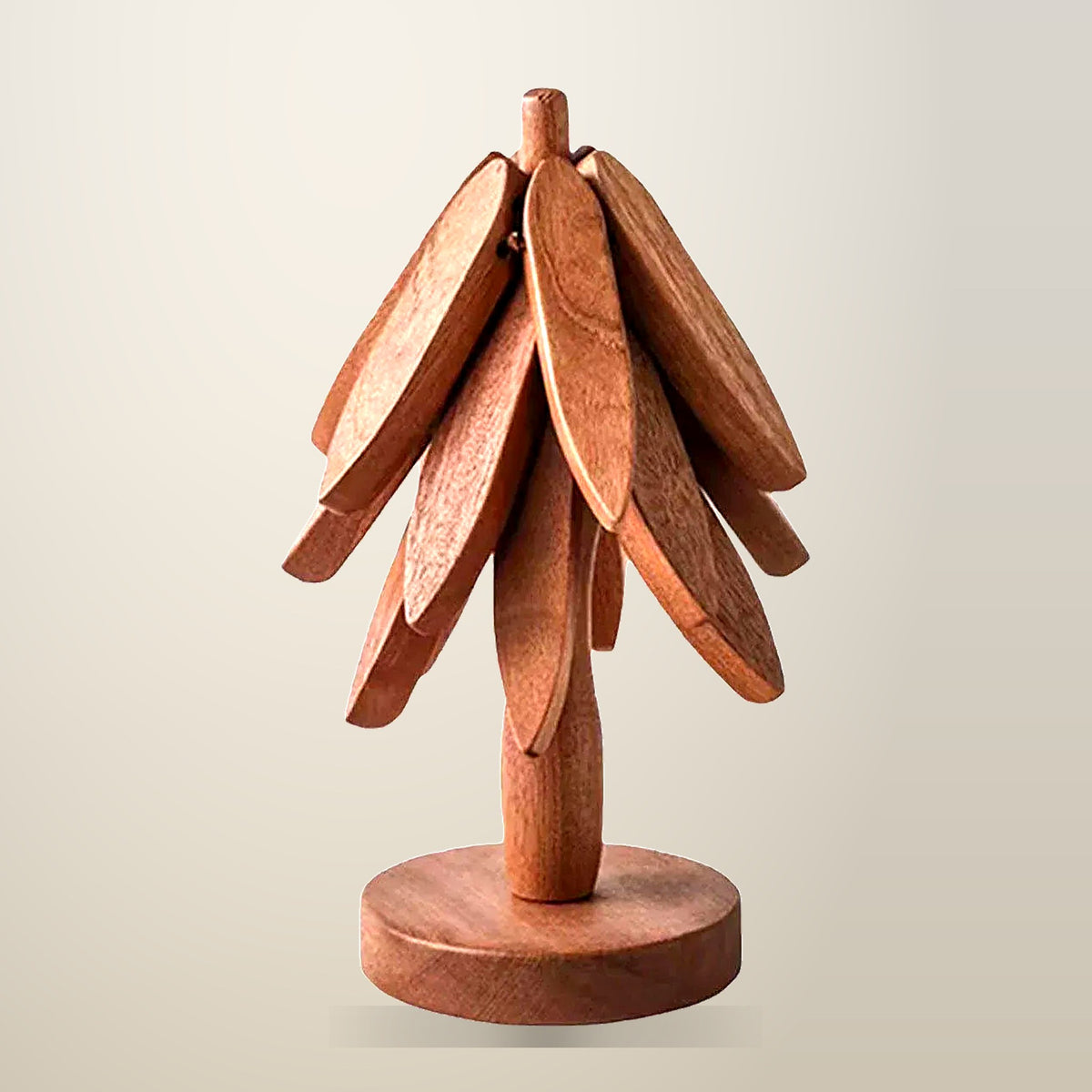 Walnut Christmas Tree Trivet with Detachable Coasters, on a plain cream background